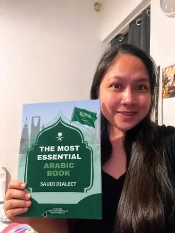 A reader holding the printed book