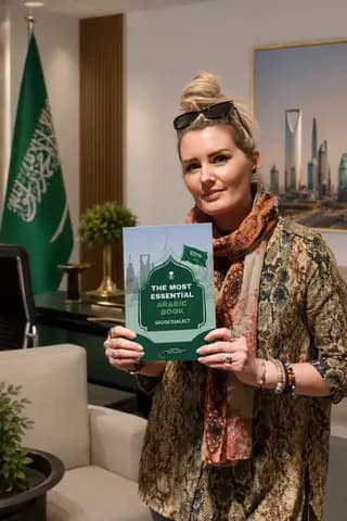 A reader holding the printed book