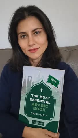 A reader holding the printed book