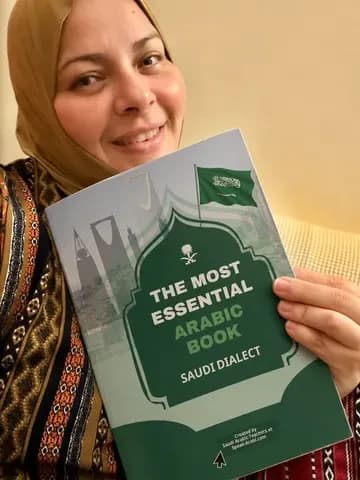 A reader holding the printed book